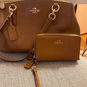 Coach cross body bag with matching wallet.